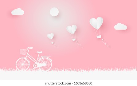 Valentine's illustration design in paper art style with a bicycle, air balloons, clouds, and sun.