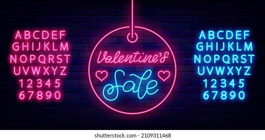 Valentines Sale neon lettering in circle label. Light advertising with alphabet. Outer glowing effect banner. Romantic holiday concept on brick wall. Editable stroke. Vector stock illustration