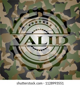 Valid written on a camouflage texture