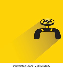 valve and pipe with shadow on yellow background