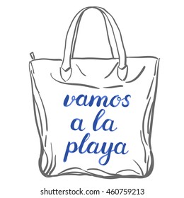 Vamos a la playa. Let's go to the beach in Spanish. Brush hand lettering on a sample tote bag. Great for beach tote bags, swimwear, holiday clothes, and more.