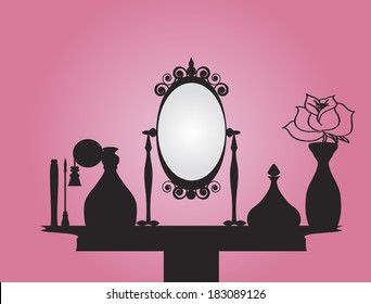 Vanity table with mirror and beauty products over pink background