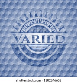 Varied blue emblem with geometric pattern.
