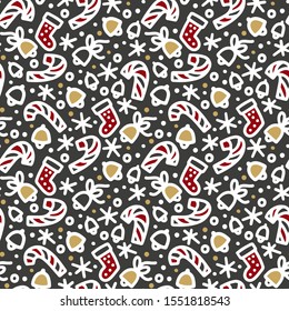 A variety of Christmas theme clipart arranged in a seamless pattern design for a Holiday gift wrapping. Candy cane, jingle bells, stocking socks, snowflakes line images on a chalkboard black.