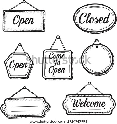 A variety of hand-drawn signs including open closed and welcome messages for shops and businesses