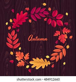 Various autumn leaves round wreath with wooden background. Oak, mountain ash, rowan, hawthorn. Retro vector illustration. Design for invitation, card, poster, flyer, banner. Place for your text