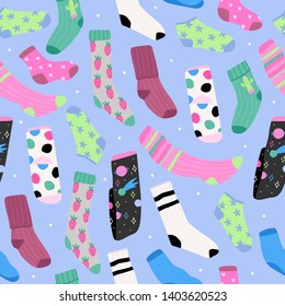 Various bright socks with different prints. High and low socks. Hand drawn vector seamless pattern. Colored trendy fashion illustration. Flat design. Blue background