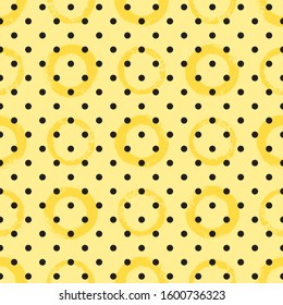 Various circles, rings, round spots seamless vector geometric pattern. Abstract brush hand drawn chaotic texture, rough shapes, objects with textured edges. Tiny black polka dots on yellow background.