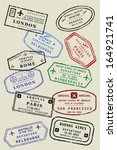 Various colorful visa stamps (not real passport stamps) on a page. International business travel concept. Frequent flyer visas.