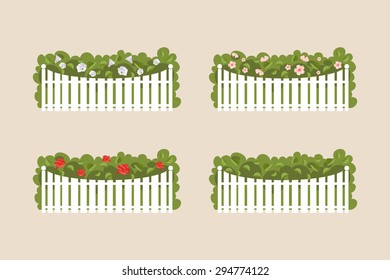 Various flowering shrubs and garden behind the white fence