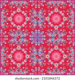 Various flowers and paisley on a bright shining crimson background in vector. A wonderful ornament for a carpet, shawl, tablecloth in the Indian style. Endless retro print for fabric.