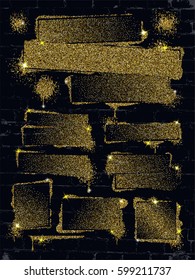 Various gold glitter spray paint graffiti on brick wall.