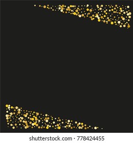 Various golden powder frame or border of random scatter golden geometric figures isolated on black.