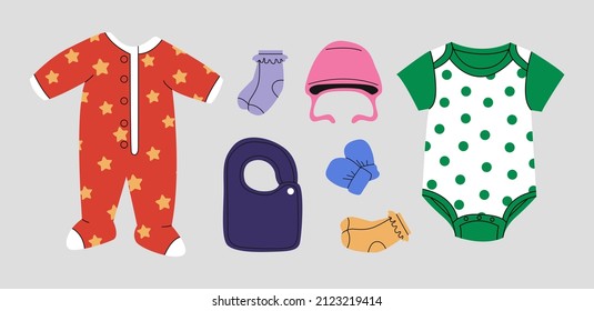 Various isolated clothes for kids and infants. Romper, hat, socks, body suit,  bib, mittens.Top view of baby clothes and accessories. Comfortable, cozy baby fashion. Hand drawn cartoon Vector set.