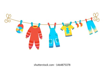 Various items of baby clothes on rope isolated vector illustration on white background. Laundry held by plastic pegs drying.