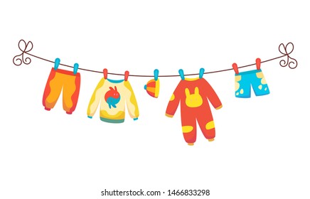 Various items of baby clothes on rope isolated vector illustration on white background. Laundry held by plastic pegs drying.