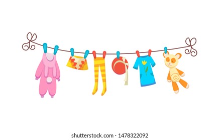 Various items of baby clothes on rope isolated vector illustration on white background. Laundry held by plastic pegs drying.