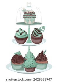 Various mint chocolate cupcakes displayed on a mint-colored three-tier cupcake stand. svg