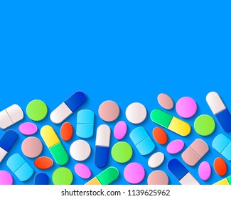 Various pills, tablets and capsules on blue background. Pharmaceutical medicine concept.