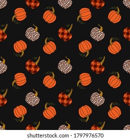 
Various pumpkins on a dark background. Leopard, orange and buffalo plaid pumpkin.Vector seamless pattern. Harvest season.  Farmhouse Decor.
