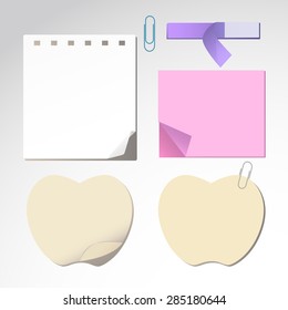 Various shapes and colors of notebook paper.