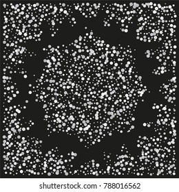 Various silver powder background of random scatter silvery geometric figures isolated on black.