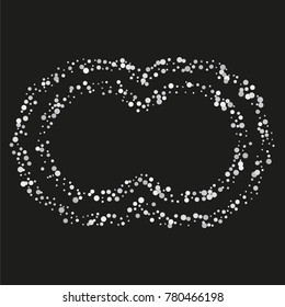 Various silver powder frame or border of random scatter silvery geometric figures isolated on black.