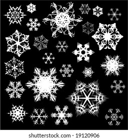 Varios copos de nieve sobre fondo negro