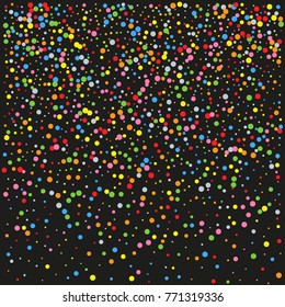 Various sparkle background of random scatter rainbow geometric figures isolated on black.