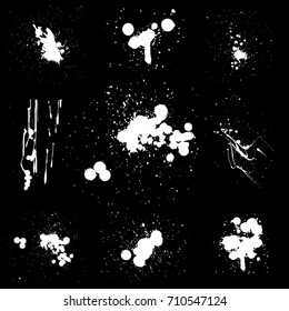 Various Spray paint graffiti decorative splatters. Vector splat set on black background