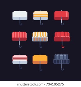 various style color umbrellas icons set, retro pixel art style vector illustration