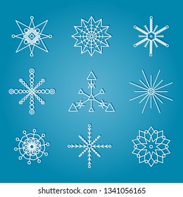 Various winter snowflakes white on blue background. Christmas and New Year decoration elements set. Vector illustration