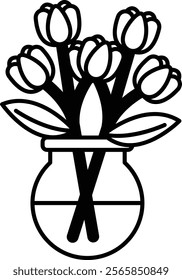 A vase with a bouquet of flowers in it. The flowers are white and the vase is clear