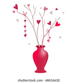 a vase containing branches with hearts on them