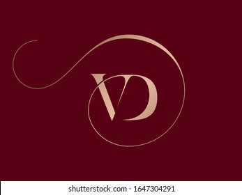 VD monogram logo.Elegant style typographic icon.Lettering sign.Gold metal alphabet initials isolated on dark fund.Uppercase luxury serif letter v and letter d.Beauty characters with decorative swirl.