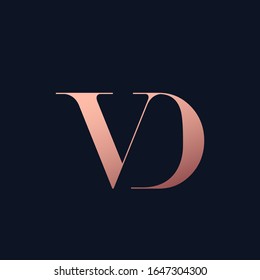VD monogram logo.Elegant style typographic icon.Lettering sign.Alphabet initials in pink metal color isolated on dark background.Uppercase luxury serif letter v and letter d.Beauty characters.