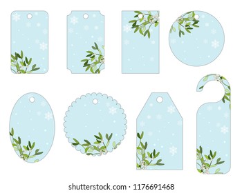 Vecror set of Christmas gift tags with mistletoe and snow. Different shapes.