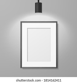 Vector 3d Realistic A4 Black Wooden Simple Modern Frame for Presentstion on a White Wall Background with a Luminous Spot Lamp on Top, Above Frame. Design Template for Mockup, Front View