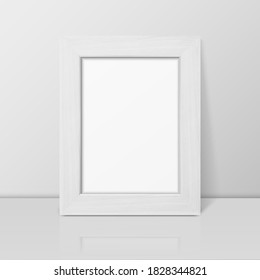 Vector 3d Realistic White Wooden Simple Modern Frame on a White Shelf, Table Agaimst the White Wall Background. It can be used for presentations. Design Template for Mockup, Front View