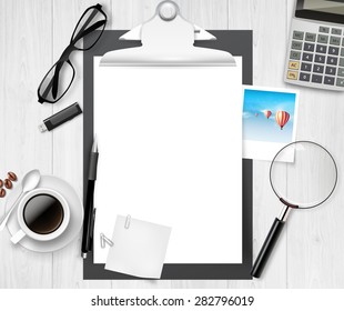 Vector above view of a wooden table, and clipboard with office material on it.