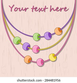 Vector abstract background with colored beads on the wooden table