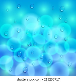 Vector abstract blue background with bokeh effect and drops
