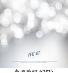 Vector abstract bokeh silver background. Festive defocused lights.