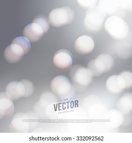 Vector abstract bokeh silver background. Festive defocused lights.