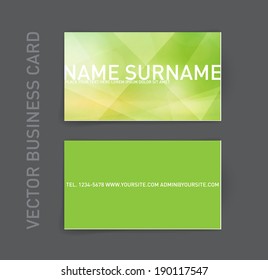 Vector abstract business card design template. Trendy glowing green polygonal geometric background.