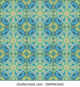 Vector abstract colorful painted kaleidoscopic graphic background. Seamless background pattern. Folk ethnic floral ornamental mandala in blue, green and beige colors.