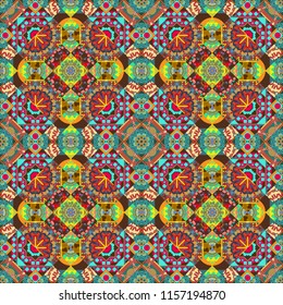 Vector abstract colorful painted kaleidoscopic graphic background. Seamless background pattern. Folk ethnic floral ornamental mandala in orange, blue and brown colors.