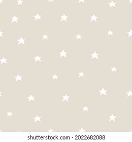 Vector abstract cute hand drawn seamless pattern with a stars on a beige background. Pastel baby texture ideal for fabric, wallpaper, wrapping paper, card, layout. Delicate children's print.