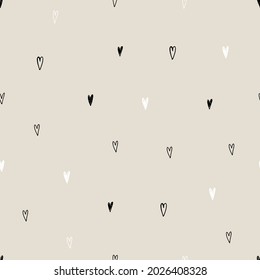 Vector abstract cute hand drawn seamless pattern with a little hearts on a beige background. Pastel baby texture ideal for fabric, wallpaper, wrapping paper, card, layout. Delicate children's print.