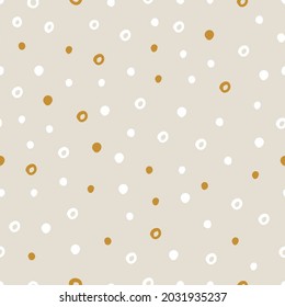 Vector abstract cute hand drawn seamless pattern with a irregular dots on a beige background. Pastel baby texture ideal for fabric, wallpaper, wrapping paper, card, layout. Delicate children's print.
